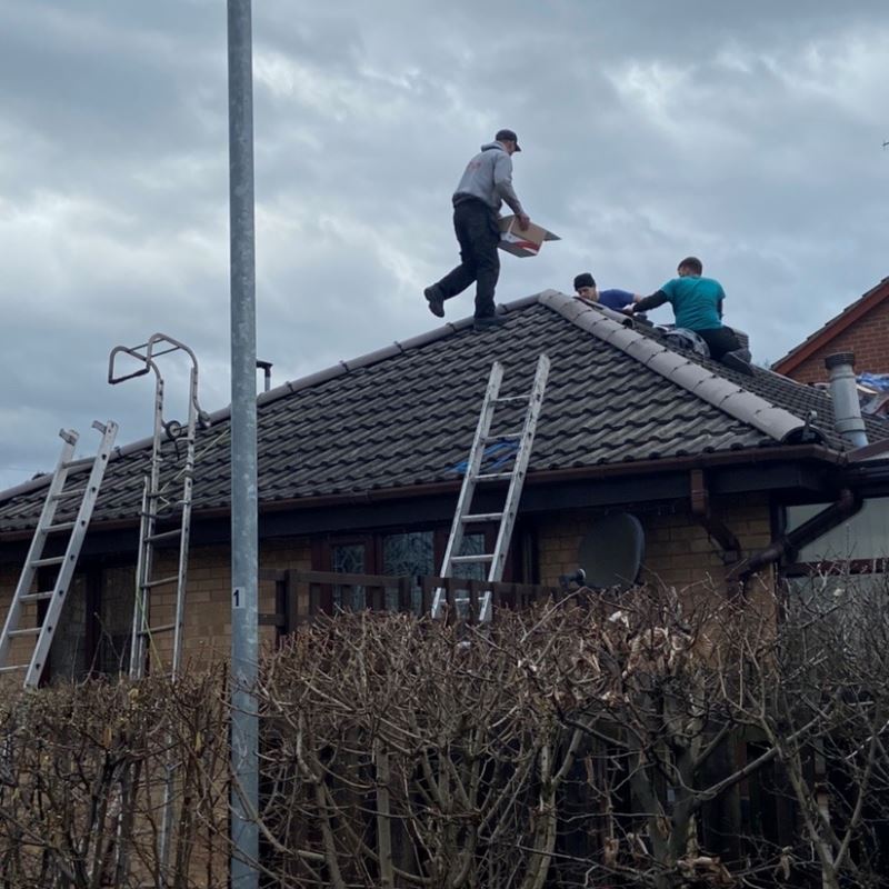 men at work on a roof